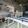 Bộ máy cắt và co màng lốc chai nước tự động tích hợp dây chuyền sản xuất
