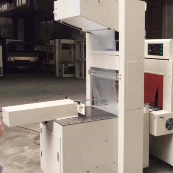 Máy cắt màng co lốc chai, thùng carton bán tự động