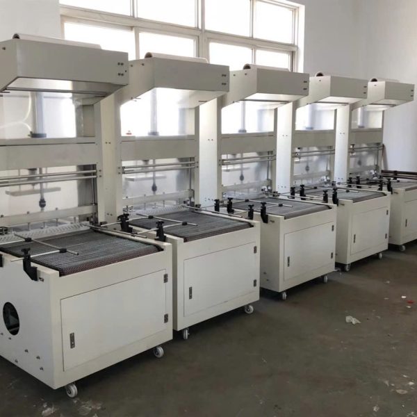 máy căt màng co lốc chai, thùng carton tự động
